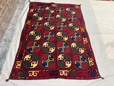 4'9x6'6 Vintage Afghan Suzani | Hand Embroidered Wool Textile | Deep Red Multicolor Oval Medallion Suzani Wall