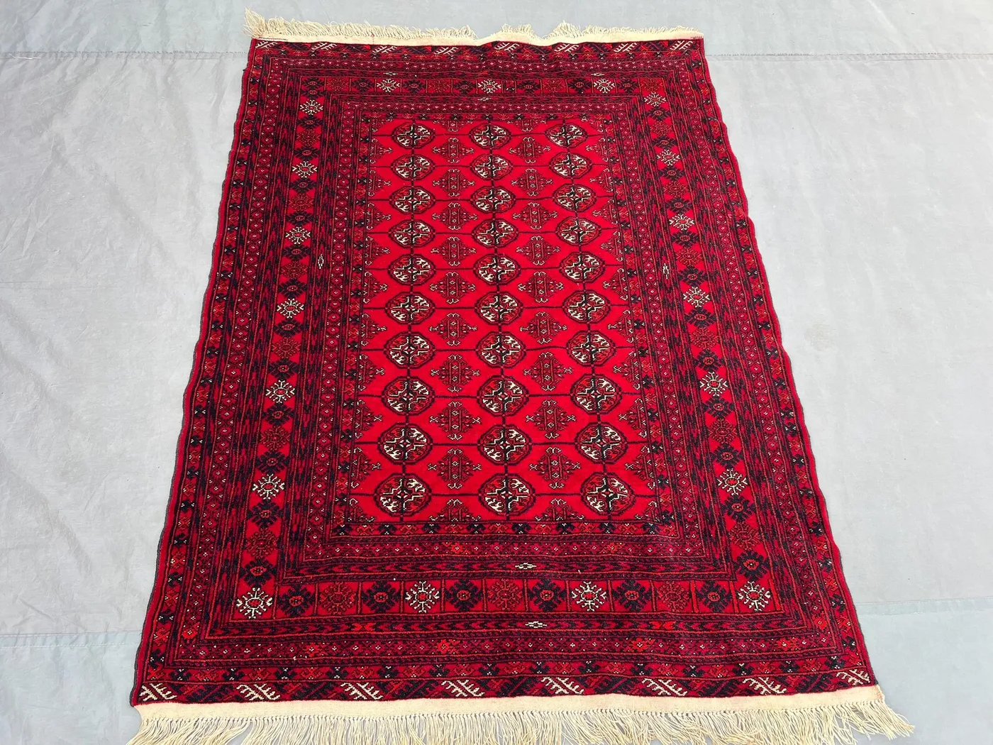4x5'5 Vintage Afghan Turkmen Bokhara Rug | Hand Knotted Wool Area Rug | Rich Red Black Gul Medallion Rug | Bohemian Living Room Rug